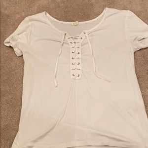 White t-shirt with ties on the front